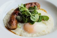 Pork Belly Sausage, Soft Boiled Eggs on Grits with BBQ Sauce